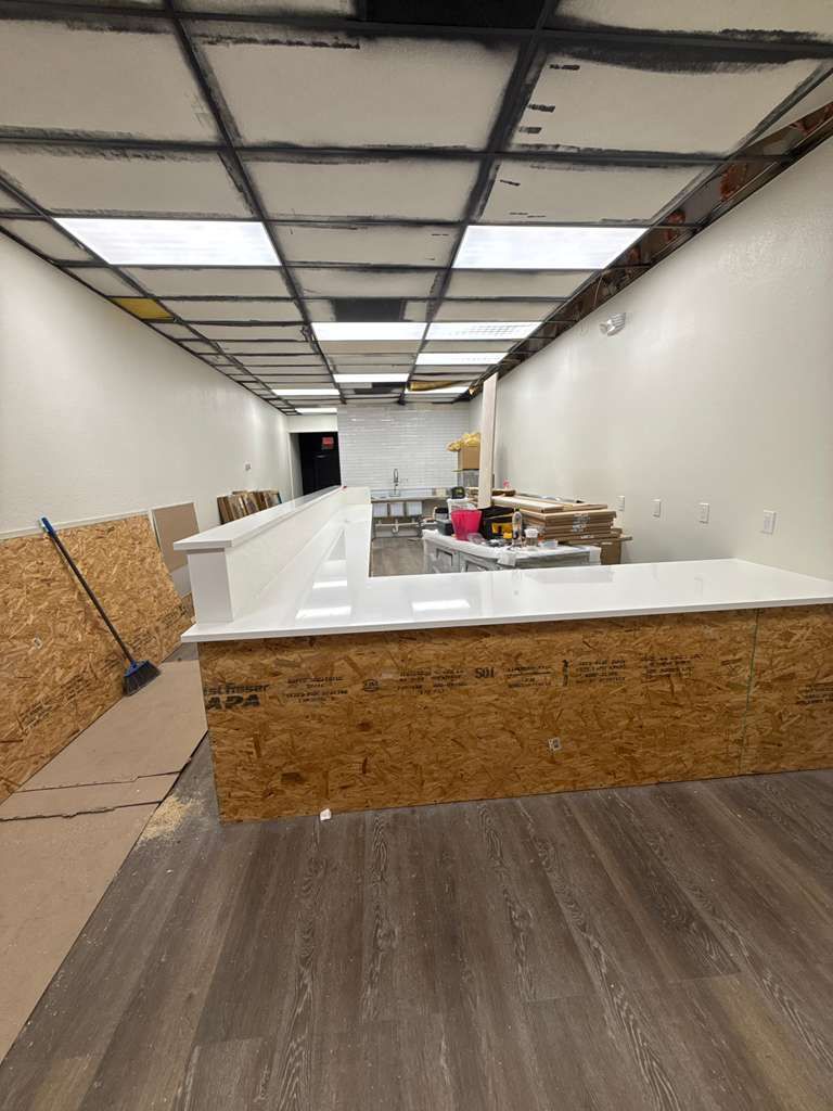 Front service counter and flooring installed in a commercial tenant space