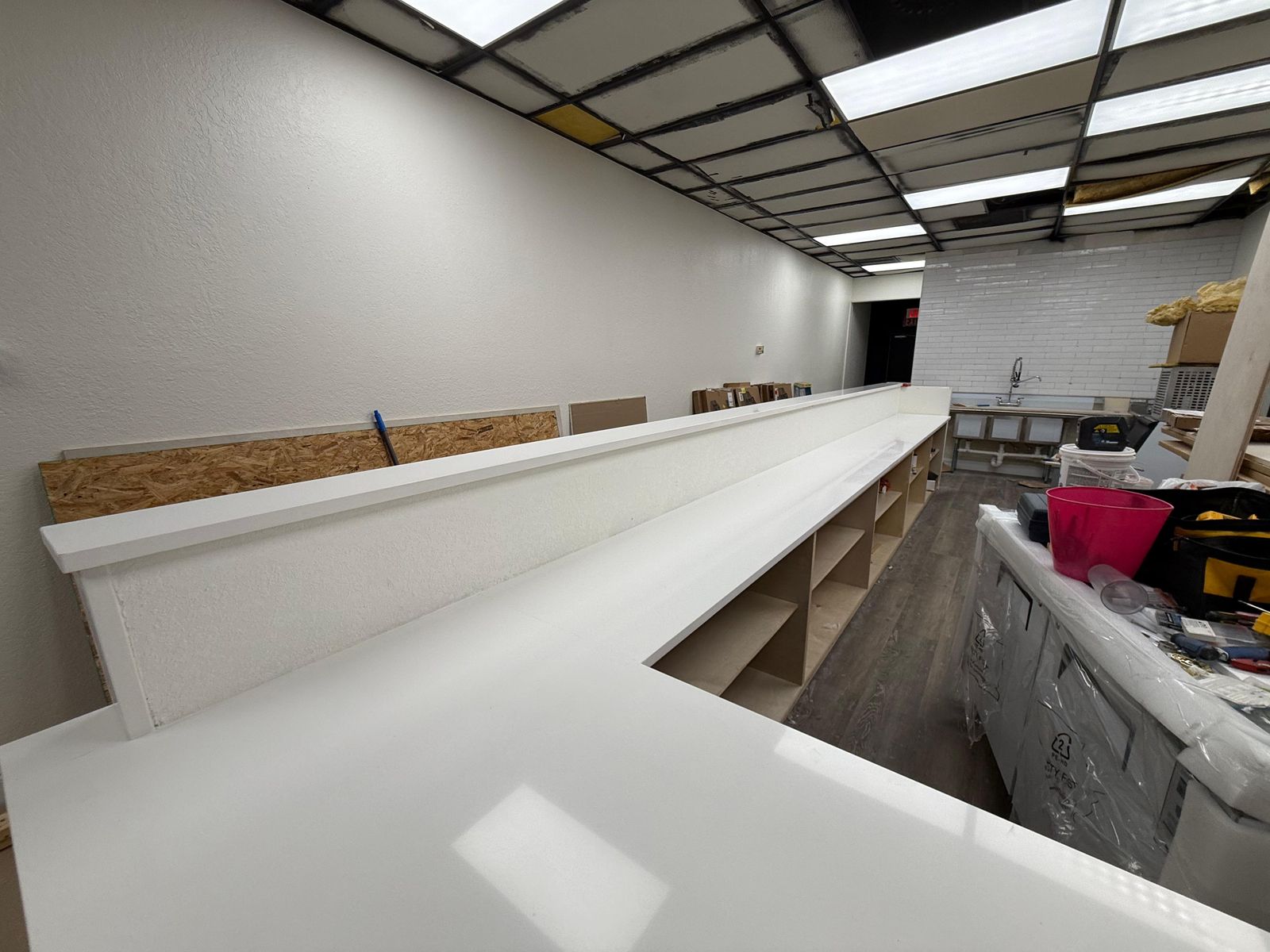 L-shaped quartz countertops installed during a commercial interior build-out