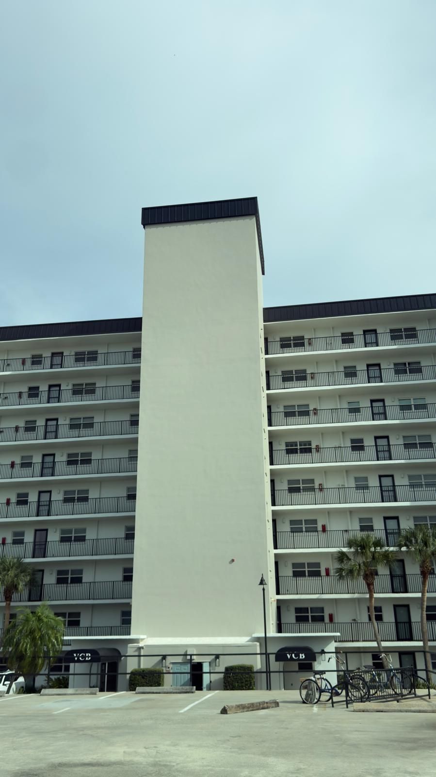 Upper-floor stucco work on a condominium building in Venice, Florida